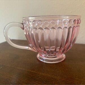 pink glass hobnail-pattern coffee mug or teacup.